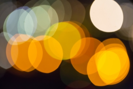 colored circles on a dark bokehの写真素材