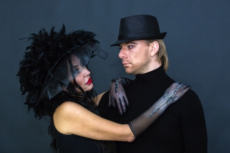 Witch and Mephistopheles on a dark 