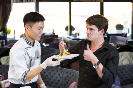 chef and the customer in a restaurant with Japanese foodの写真素材