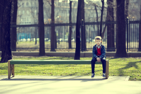 Portrait of a boy on a walk in the parkの写真素材