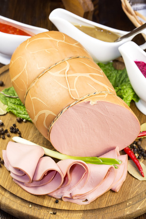 sausage on a wooden plate in a restaurantの写真素材