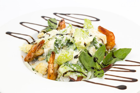 Caesar salad on the table in a restaurantの写真素材