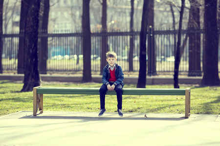 Portrait of a boy on a walk in the parkの写真素材