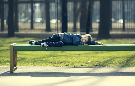 Portrait of a boy on a walk in the parkの写真素材