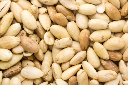 Background of peeled almonds closeup shotの写真素材