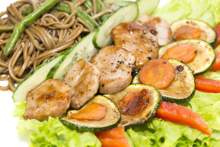with vegetables and spaghetti on a white backgroundの写真素材