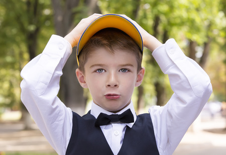Portrait of a boy on a background of green natureの写真素材