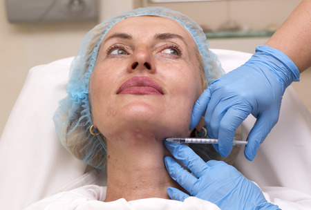 Cosmetic treatment with injection in a clinic