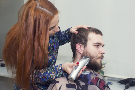young man in a barber shaved shornの写真素材
