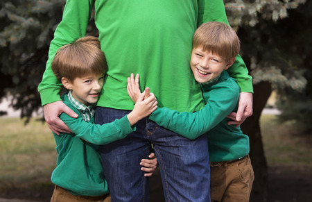 Portrait of a boy on a background of green natureの写真素材