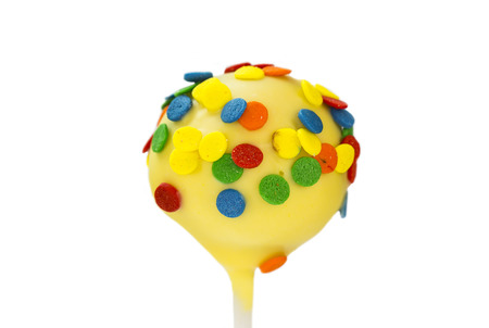 chocolate candy on a stick on a white backgroundの写真素材