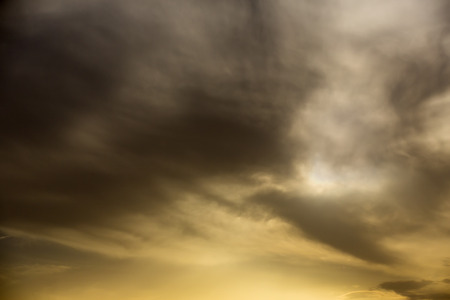 sky background with clouds of different colorsの写真素材