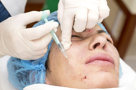 Cosmetic treatment with injection in a clinic