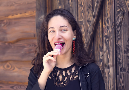young girl eating an ice cream vanilla