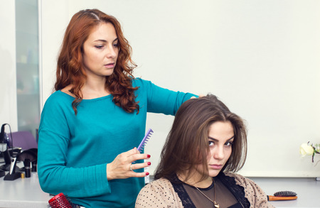 woman in a beauty salon doing hairの写真素材