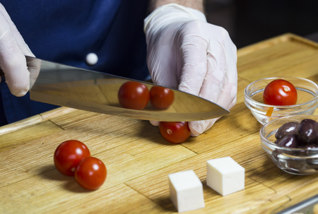 cook prepares canapes in the kitchen at the restaurantの写真素材