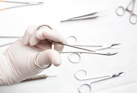 styryl surgical instrument in the surgeon\'s hand