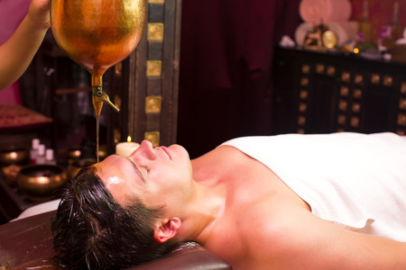people man engaged in Ayurvedic spa treatmentの写真素材