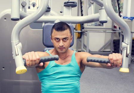 Young man training in the gym