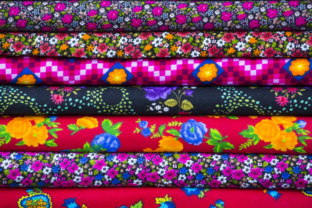 Background of the scrolls rolls colored colorful fabricの写真素材