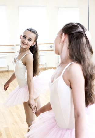 little girl dressed as a ballerina in balletの写真素材