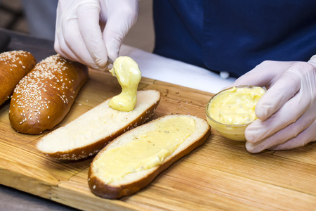 cook prepares canapes in the kitchen at the restaurantの写真素材