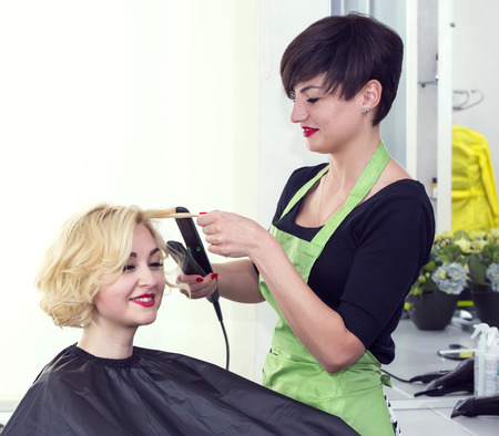 woman in a beauty salon doing hairの写真素材