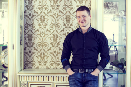 Portrait of an adult male in the background wallの写真素材