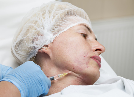 Cosmetic treatment with injection in a clinic
