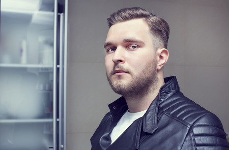 Portrait of an adult male in the background wallの写真素材