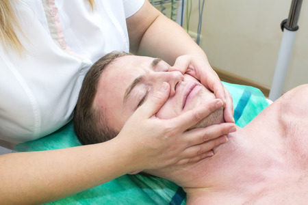 man in the mask cosmetic procedure in spa salonの写真素材