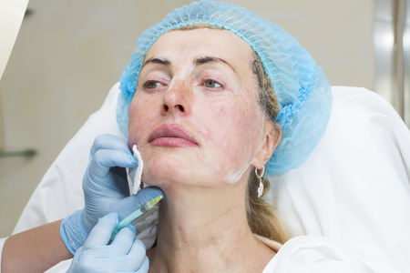Cosmetic treatment with injection in a clinic