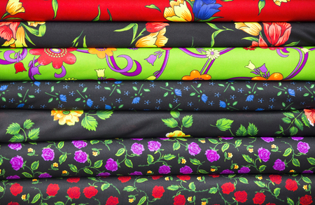 Background of the scrolls rolls colored colorful fabric