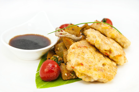 shrimp patties of meat with a salad of eggplant on a white background in restorneの写真素材