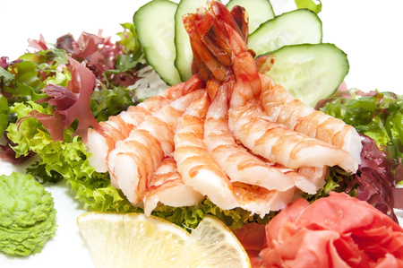 Japanese cuisine sashimi with vegetables and fish in a restaurantの写真素材