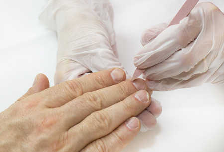 the process of the male manicure in a beauty salonの写真素材