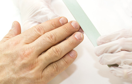 the process of the male manicure in a beauty salonの写真素材
