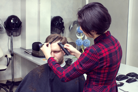 The young man at the hairdresser salon hairstyle make modelの写真素材