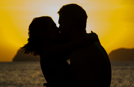 Silhouettes loving couple at sunset on the Philippine Islandsの写真素材