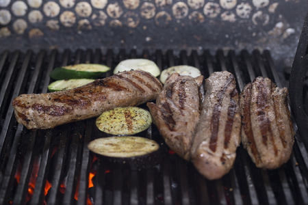 steaks cooked on a grill in the restaurant