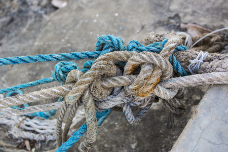 Knotted knots on old worn ropesの写真素材