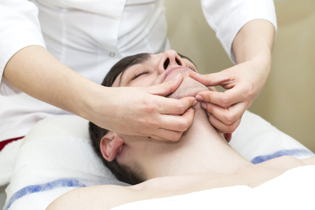 man in the mask cosmetic procedure in spa salonの写真素材