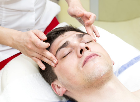man in the mask cosmetic procedure in spa salonの写真素材