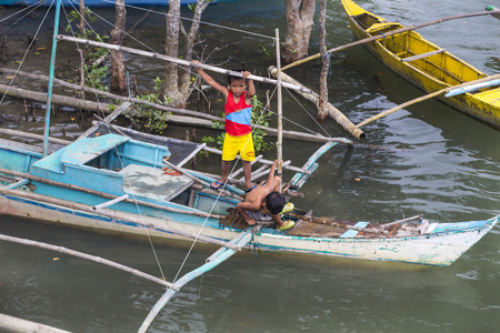 BUKANA, PHILIPPINES - FEB. 3: Morning in the harbor fishing village Bucana FEB. 3, 2016 in Bucana Philippines.のeditorial素材
