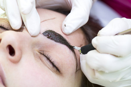 Mikrobleyding eyebrows workflow in a beauty salonの写真素材