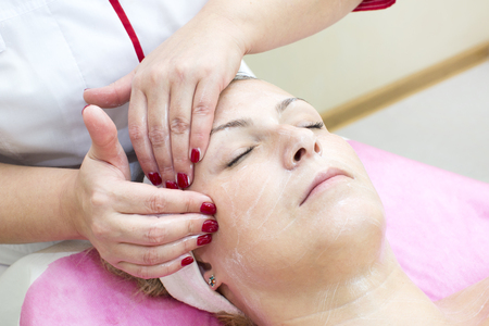 process of massage and facials in beauty salonの写真素材