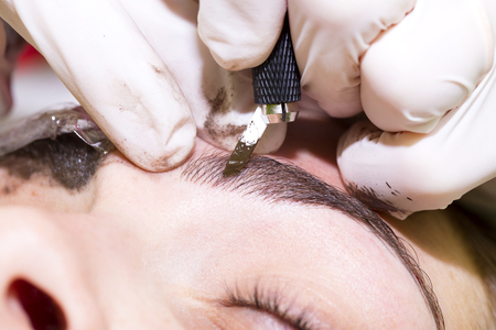 Mikrobleyding eyebrows workflow in a beauty salonの写真素材