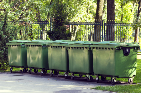Plastic containers for garbage in the green park