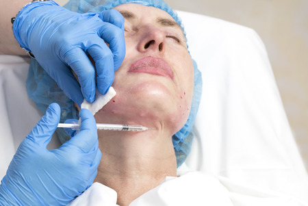 Cosmetic treatment with injection in a clinicの写真素材