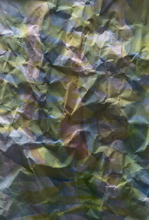 Background of colored crumpled paper shot close-upの写真素材